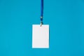 Empty ID card badge icon with blue belt, on blue background. Royalty Free Stock Photo