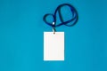 Empty ID card badge icon with blue belt, on blue background. Royalty Free Stock Photo