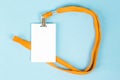 Empty ID card / icon with an orange belt, on a blue background. Royalty Free Stock Photo