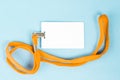 Empty ID card / icon with an orange belt, on a blue background. Royalty Free Stock Photo