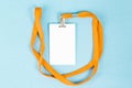 Empty ID card / icon with an orange belt, on a blue background. Royalty Free Stock Photo