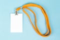 Empty ID card / icon with an orange belt, on a blue background. Royalty Free Stock Photo