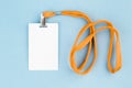 Empty ID card / icon with an orange belt, on a blue background. Royalty Free Stock Photo