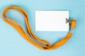 Empty ID card / icon with an orange belt, on a blue background. Royalty Free Stock Photo