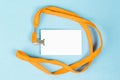 Empty ID card / icon with an orange belt, on a blue background. Royalty Free Stock Photo