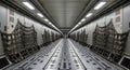 Empty, illuminated cargo aircraft bay reveals extensive roller floor systems and restraint netting securely fastened. Royalty Free Stock Photo