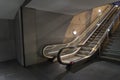 Empty illuminated escalator with a dirtproof grating at night