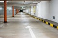 Empty illuminated underground car parking space large area wide angle view no people Royalty Free Stock Photo