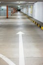 Empty illuminated underground car parking space large area wide angle view no people Royalty Free Stock Photo