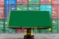 Empty industrial green container box for put information on loading via forklift vehicle working on outdoor terminal warehouse