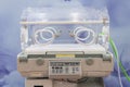 Empty infant incubator in an hospital room. Specially equipped room with newborn babys sleeping in incubators in the Obstetrics Royalty Free Stock Photo