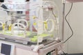 Empty infant incubator in an hospital room. Specially equipped room with newborn babys sleeping in incubators in the Obstetrics