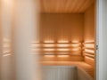 Empty infrared sauna is glowing with warm inviting light. Royalty Free Stock Photo
