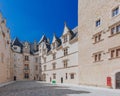 Empty inner courtyard of the ChÃÂ¢teau de Pau against blue sky, in the city centre of Pau, France