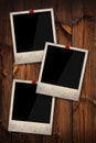 Empty instant photo frames pinned on wooden wall Royalty Free Stock Photo