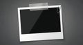Empty instant photo mockup taped on dark background Royalty Free Stock Photo