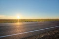 Empty intercity road with asphalt surface and white markings in evening Royalty Free Stock Photo