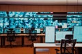 Empty interior of big modern security system control room, workstation with multiple displays, monitoring room with at