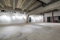 Empty interior of large concrete room as warehouse or hangar with spotlights Royalty Free Stock Photo