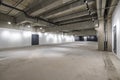 Empty interior of large concrete room as warehouse or hangar with spotlights Royalty Free Stock Photo