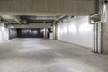 Empty interior of large concrete room as warehouse or hangar with spotlights Royalty Free Stock Photo