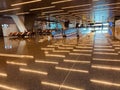 Empty interior space with ceiling lights reflection in Doha airport