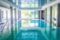 Empty interior swimming pool with relaxation area. Royalty Free Stock Photo