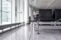 Empty international airport terminal gate waiting room during peak season