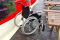 Empty invalids wheelchair in sea beach cafe