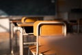 Empty Japanese school classroom with wooden chairs, desks and a blackboard. Royalty Free Stock Photo