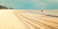 Empty Jurmala beach with lonely girl figure - retro filter. Royalty Free Stock Photo
