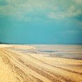 Empty Jurmala beach out of season - vintage photo. Spring seascape - retro filter.