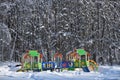 Empty kids playground in winter city park Royalty Free Stock Photo