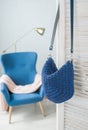 Empty knitted purse hanging on wooden door