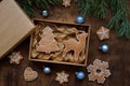 Empty kraft box with brown lid for sweets, cookies on New Year`s table with gingerbread for home delivery from pastry shop