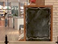 Empty large menu board indoor cafe, blank wooden black board at restaurant Royalty Free Stock Photo