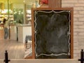 Empty large menu board indoor cafe, blank wooden black board at restaurant Royalty Free Stock Photo