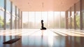 Empty Large Room with wooden floor and powerful Sunlight with a woman silhouette meditating seated - AI generated
