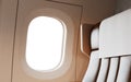 Empty Leather Chair Background Inside Interior First Class Airplane Private Jet. Blank White Illuminator Mockup Ready Royalty Free Stock Photo