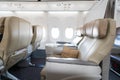 Empty leather seats in row atBusiness class reclined seats of ai