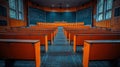 Empty lecture hall with orange seats, large chalkboard, and high windows Royalty Free Stock Photo