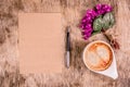 Empty letter, a cup of coffee and flowers. Romantic concept.