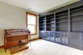 Empty library office room with piano. New luxury home interior. Royalty Free Stock Photo