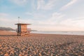 Empty lifeguard tower on sandy beach at sunrise Royalty Free Stock Photo