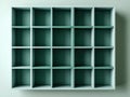 Empty light teal shelving unit with multiple equally sized cubby compartments viewed from above for versatile storage and Royalty Free Stock Photo