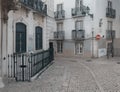 An empty Lisbon street dressed in traditional paving