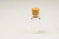 Empty little bottle with cork stopper isolated on white. transparent container. test tube. copy space Royalty Free Stock Photo