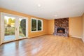 Empty living room with brick fireplace and hardwood floor Royalty Free Stock Photo