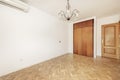 empty living room with built-in wooden wardrobe with air conditioner,