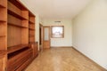 Empty living room with cherry wood bookcase and serving Royalty Free Stock Photo